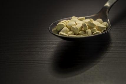 Pile of pills on a spoon